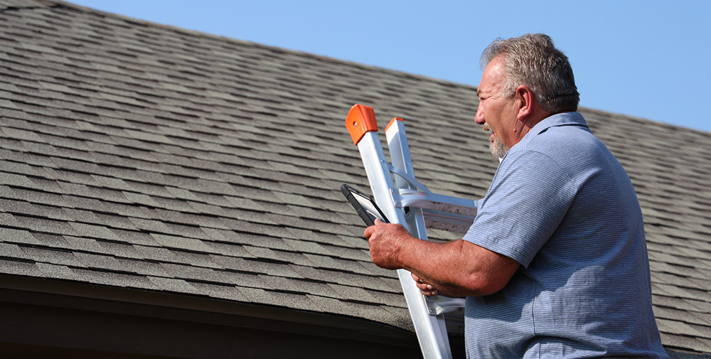One of our home inspectors, Marty Harrington, doing a roof inspection